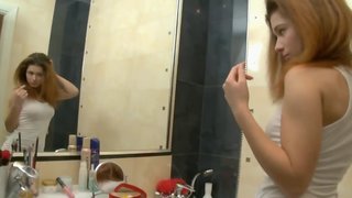 Sweet girl Kisa is toying with pussy in the bathroom