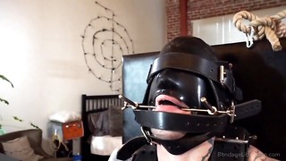 BDSM video of a tied dude that enjoys being all locked up